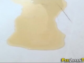 Japanese babe pees puddle
