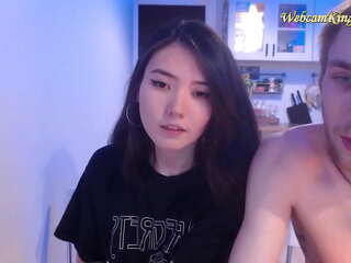 Petite asian teen chilling with white guy on webcam